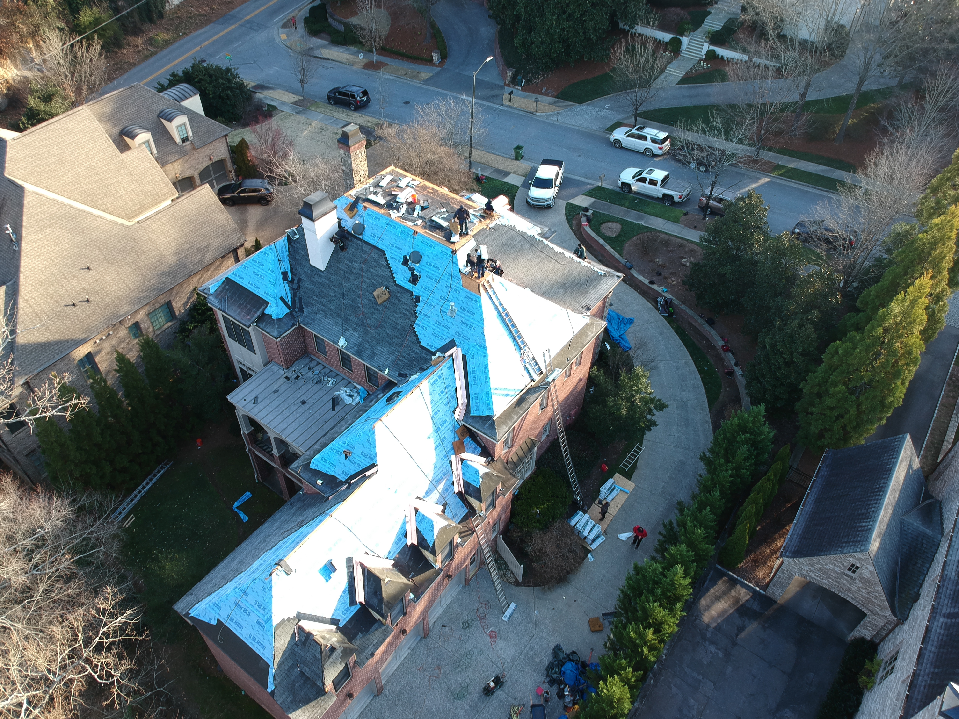 Roof replacement before and after — drone comparison documentation